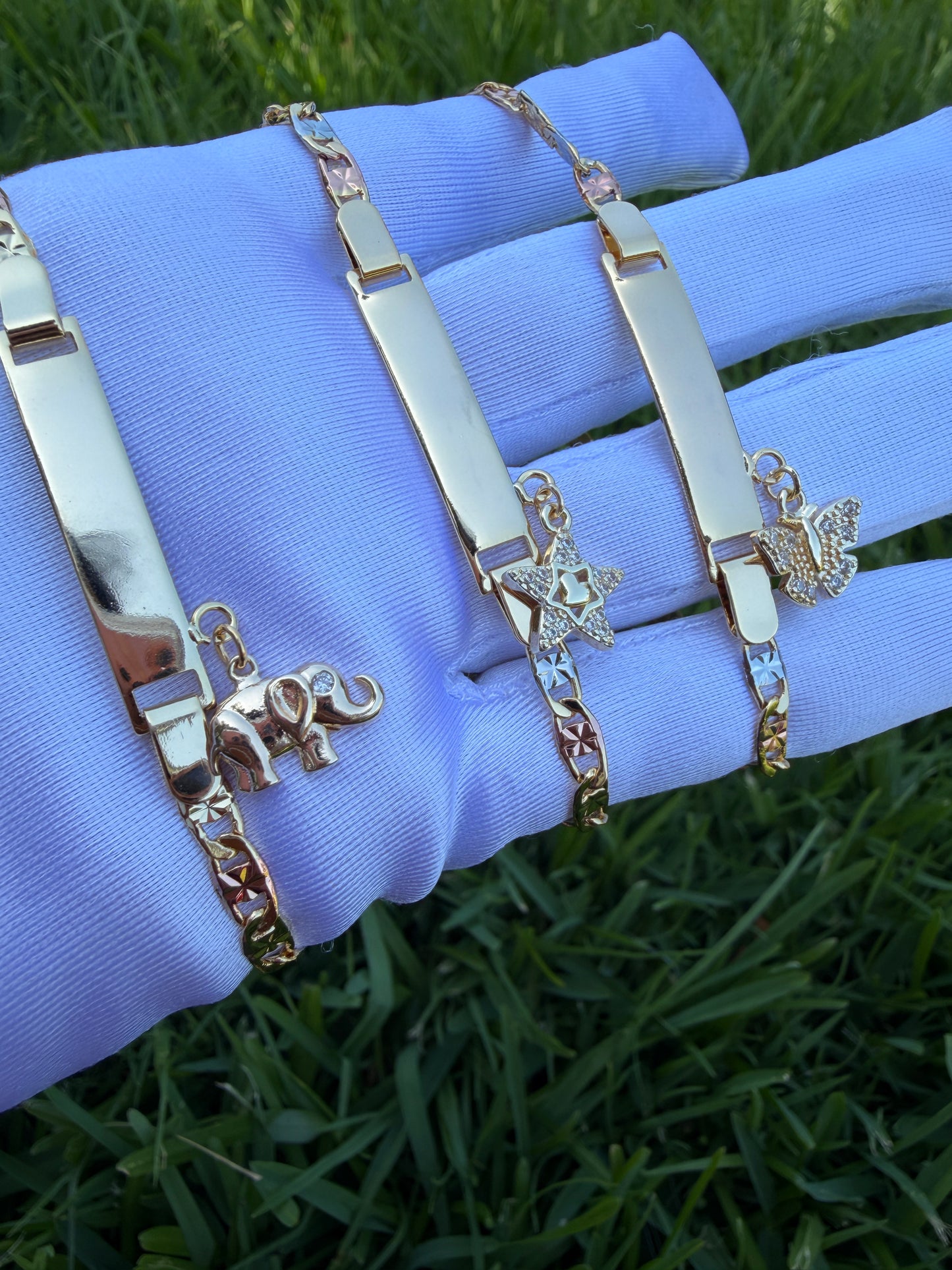 Elegant Elephant, Star, and Butterfly Charms on Gold-Tone Bracelet 7.5 inches