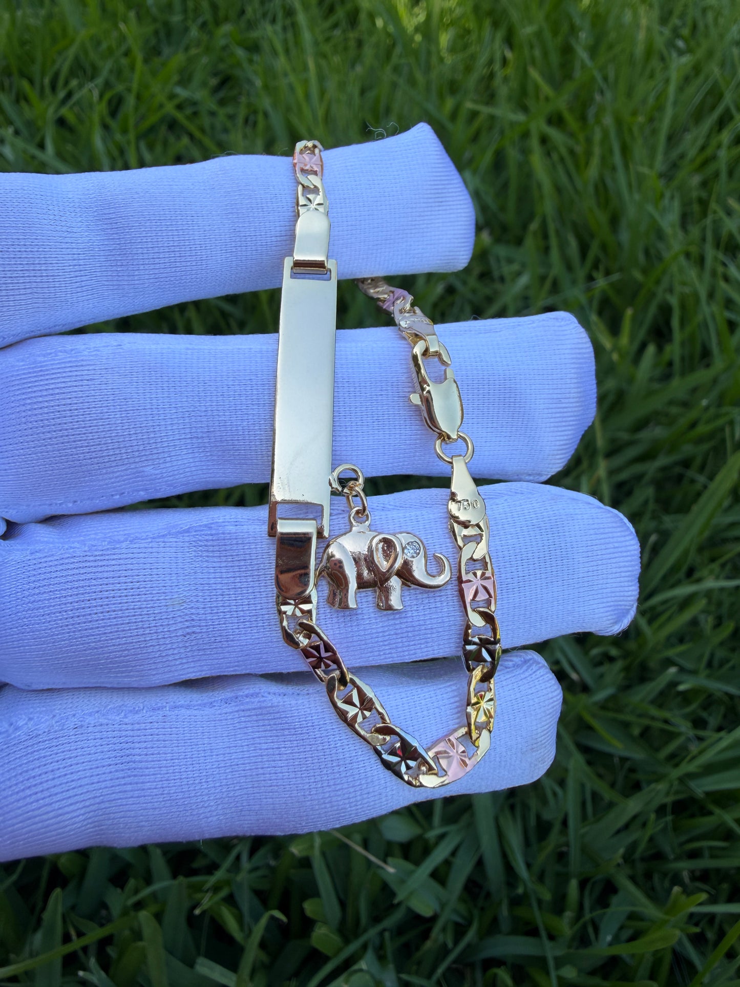 Elegant Elephant, Star, and Butterfly Charms on Gold-Tone Bracelet 7.5 inches